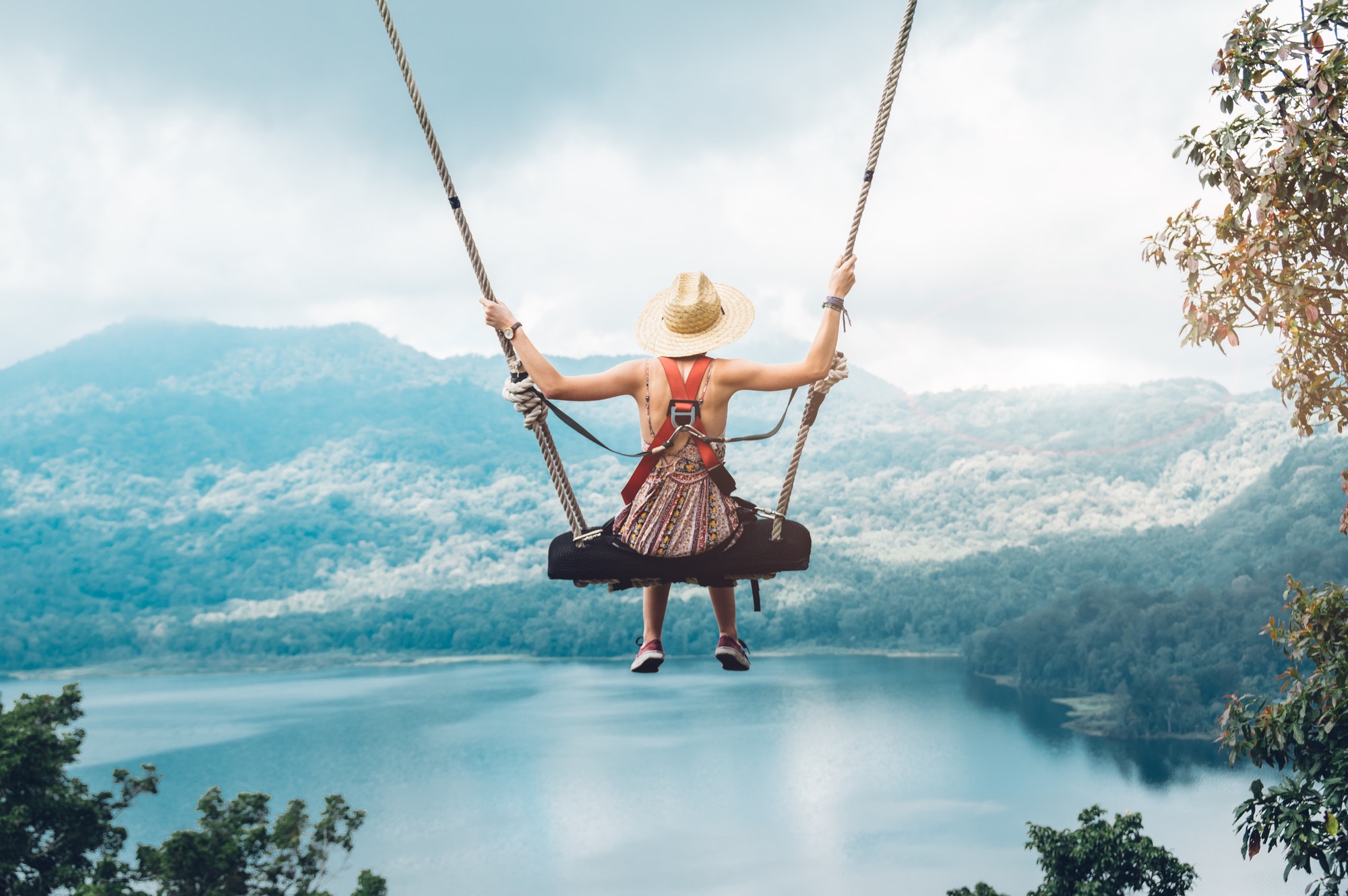 beautiful-girl-enjoying-freedom-on-swing-in-bali-indonesia.jpg